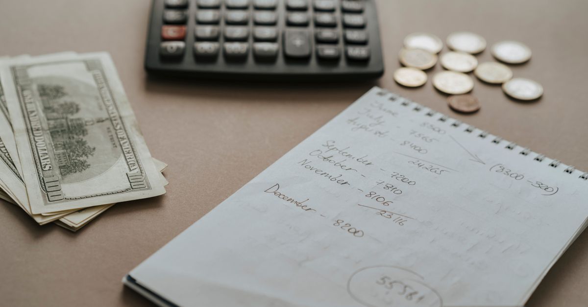 An open notebook and pen on a table, ready for thoughtful household budget planning